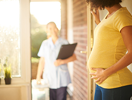 Pregnant woman with midwife